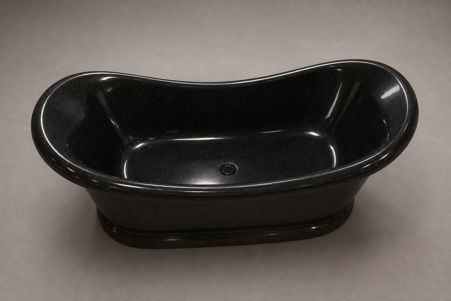 Vallora black granite bathtub with deep polished basin and center drain, top view