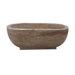 Real side view of the YVANA Brown Travertine freestanding bathtub showing its solid stone base