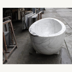 Celeste Ivory Cloud Marble soaking bathtub, real end view and sculptural bowl profile