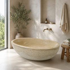 YARA Beige Travertine bathtub close product detail showing the hand-chiseled exterior finish