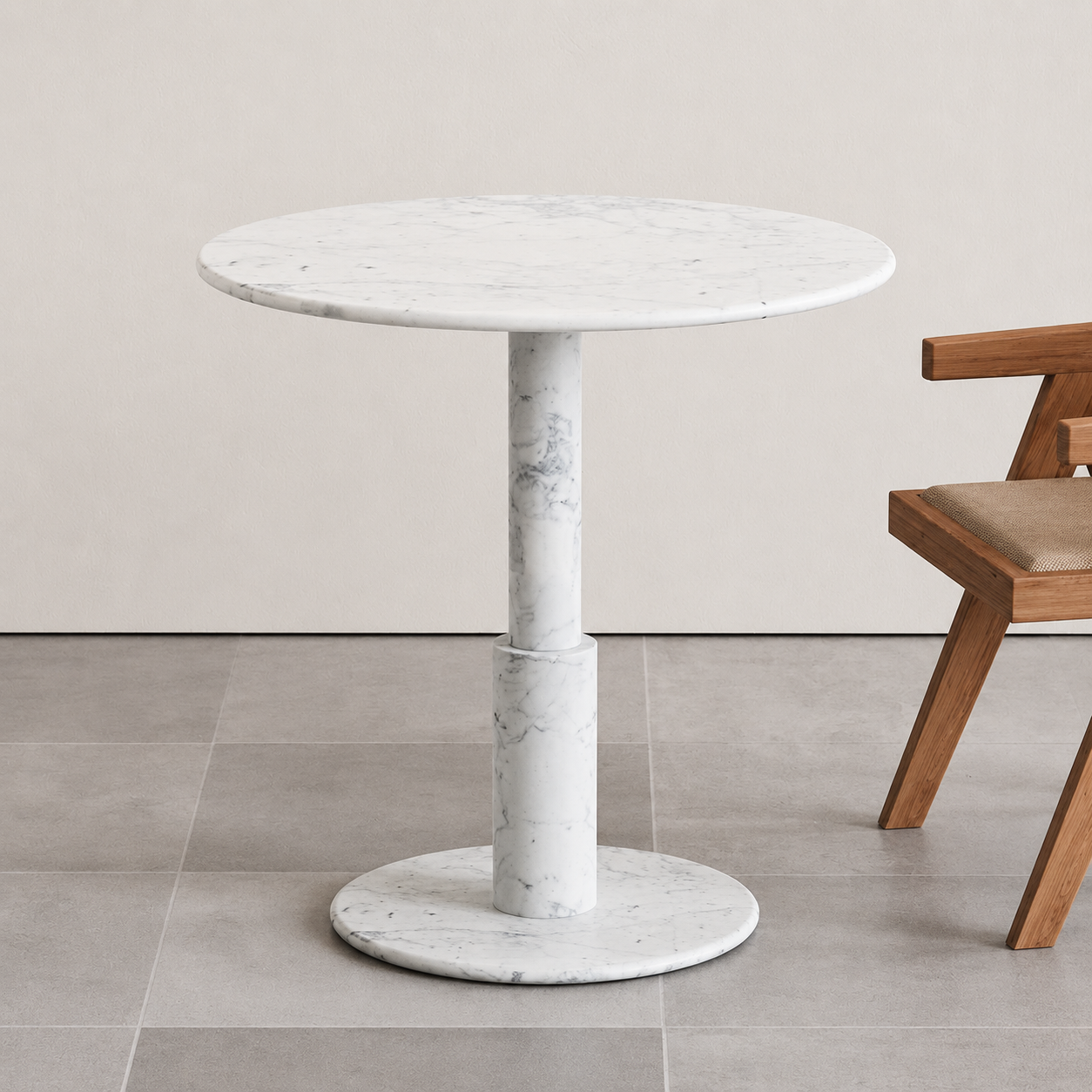 RoundTwin Elite Carrara white marble dining table with round pedestal base in a modern dining space