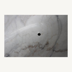 Elara solid marble bathtub polished interior and drain opening detail