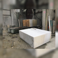 OIXDESIGN natural stone bathtub production process showing solid stone block preparation in the workshop