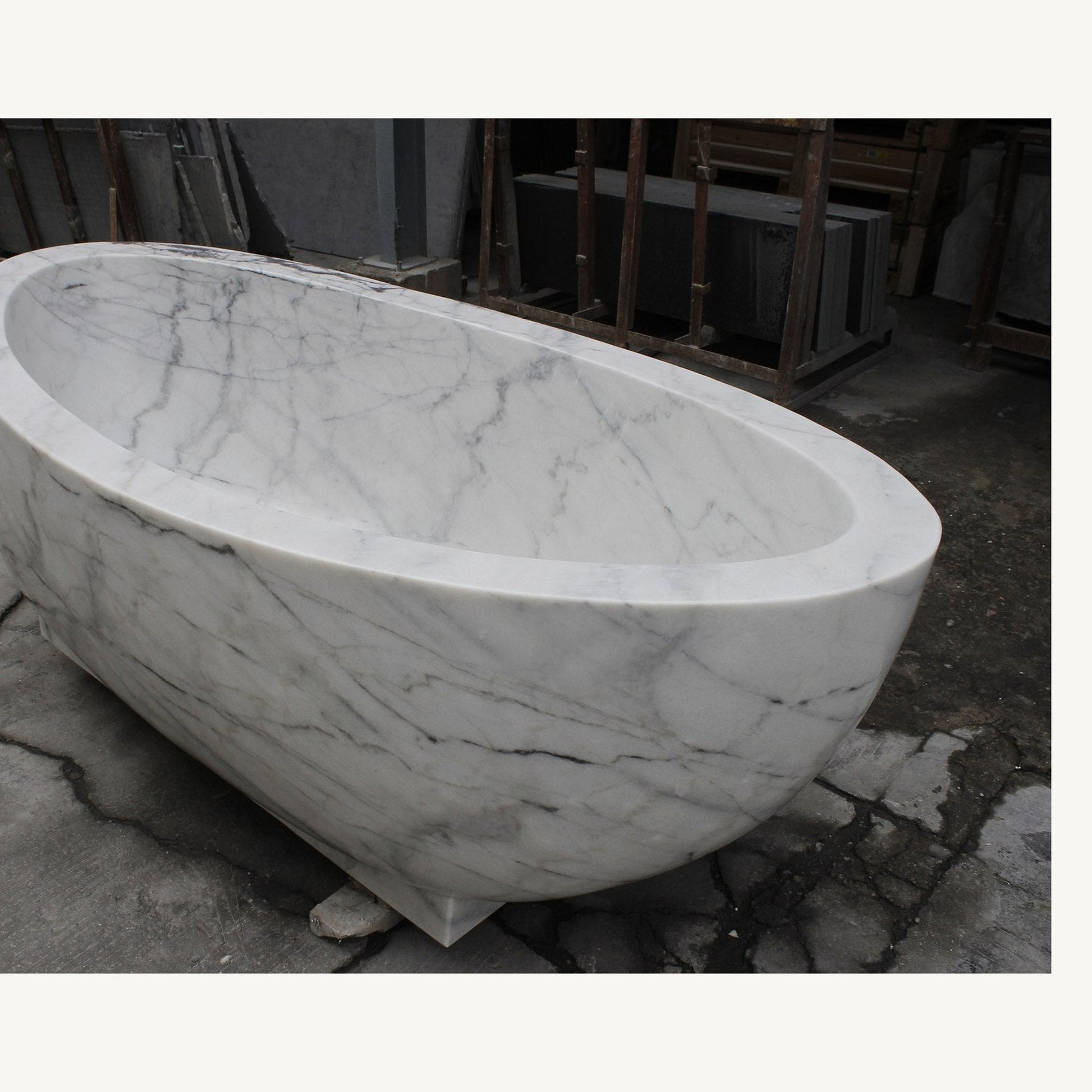 Celeste Ivory Cloud Marble soaking bathtub, real high-angle view of rim and interior