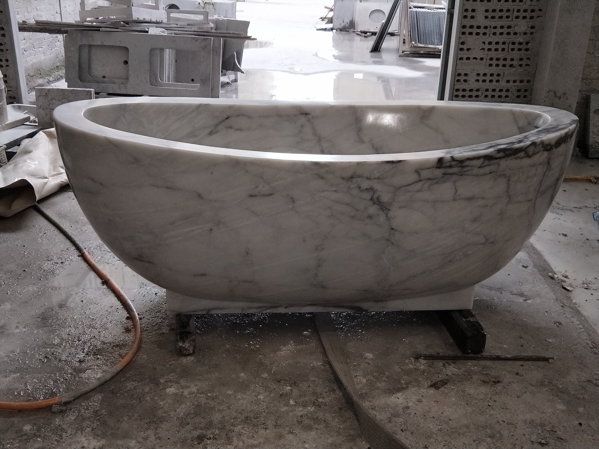 Actual Aurelia BT-038A solid marble pedestal bathtub, end view