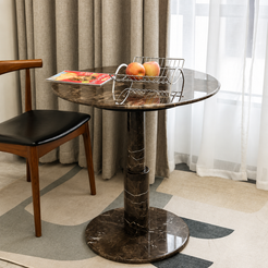 RoundTwin Elite dark marble dining table styled with warm interior decor