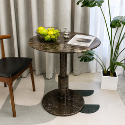 RoundTwin Elite dark marble dining table styled with greenery and warm interior decor