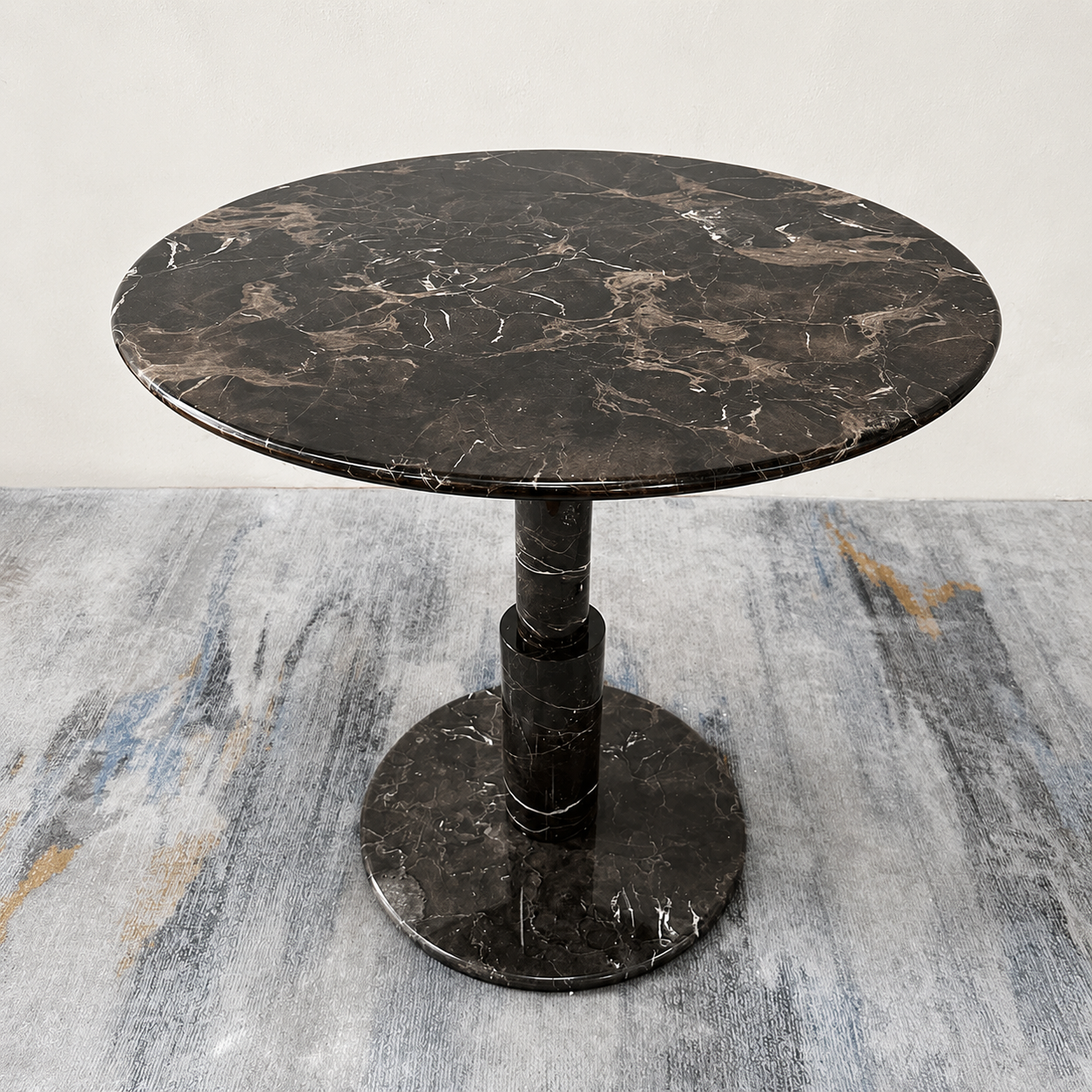 RoundTwin Elite black marble dining table top view showing round pedestal base and dark stone texture