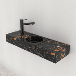 Angled side view of the Eira Galaxy marble sink showing its narrow counter and veining