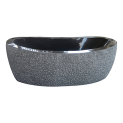 Calia Absolute Black Granite soaking bathtub with hand-chiseled exterior and polished interior, studio three-quarter visualization