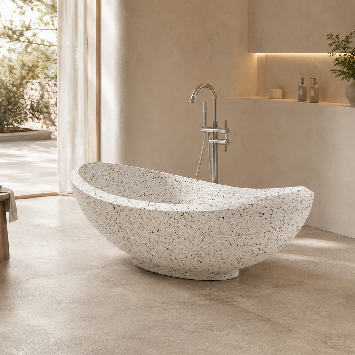 Yuna BT-032A alba-white-terrazzo freestanding soaking bathtub in a warm neutral architectural bathroom, hero lifestyle view