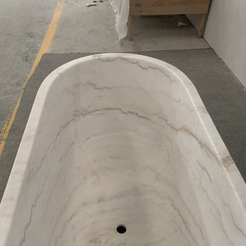 Serena BT-105A Ivory Cloud Marble bathtub, original product detail; source photograph reframed without changing the stone, rim or silhouette