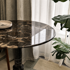 RoundTwin Elite black marble dining table close-up showing natural dark Emperador stone veining