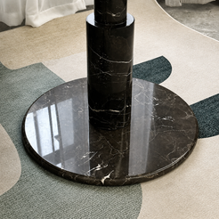 RoundTwin Elite black marble dining table leg and base close-up with dramatic natural veining
