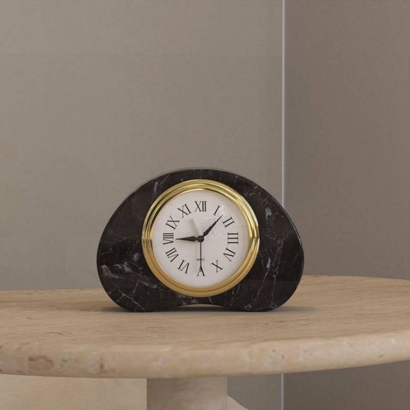 Black PeaPod Marble Clock with a gold-rimmed Roman numeral dial, adding a sophisticated touch to any space with its sleek marble design.