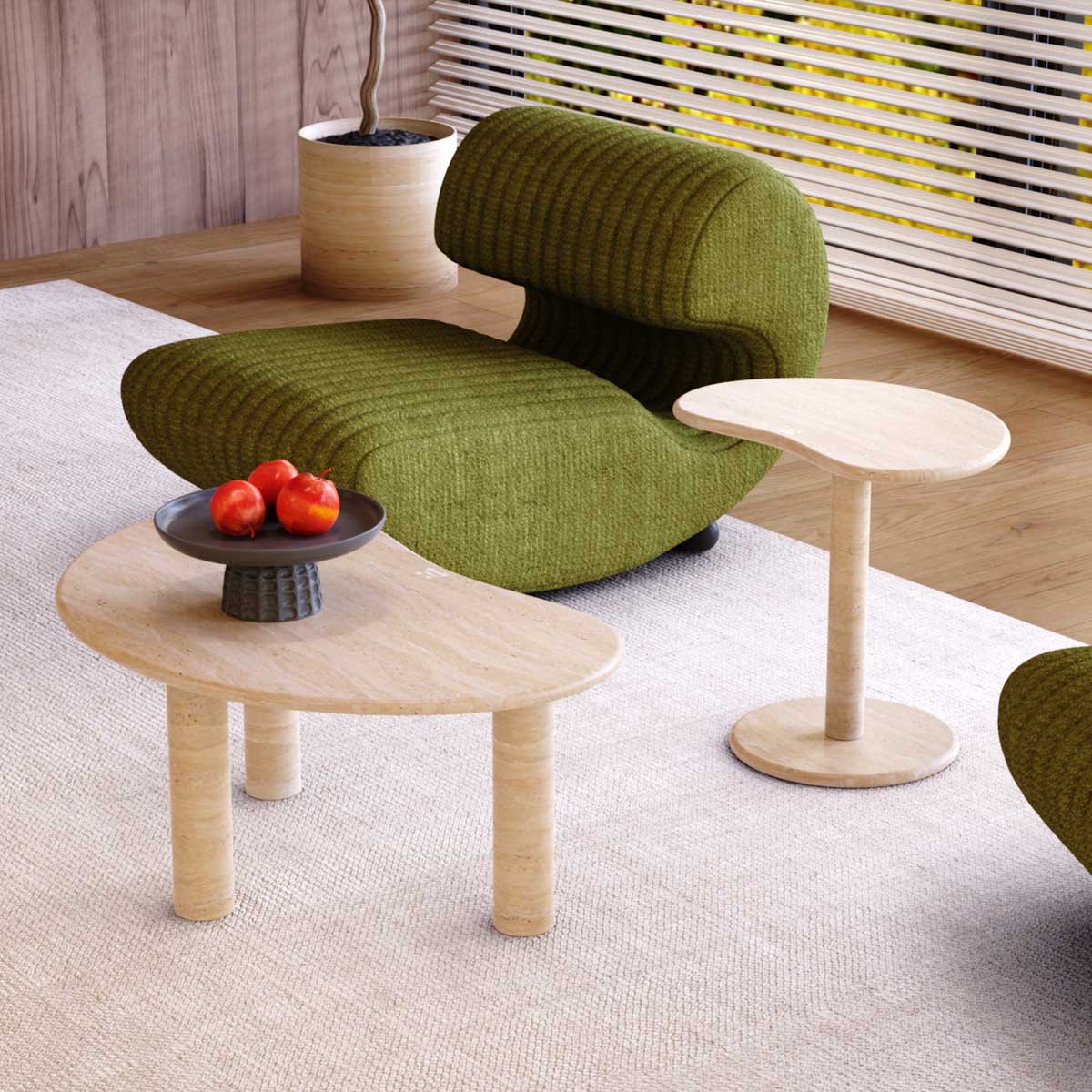 PeaPod Oval Travertine Coffee Table with a matching side table, complementing a green accent chair in a contemporary home setting.