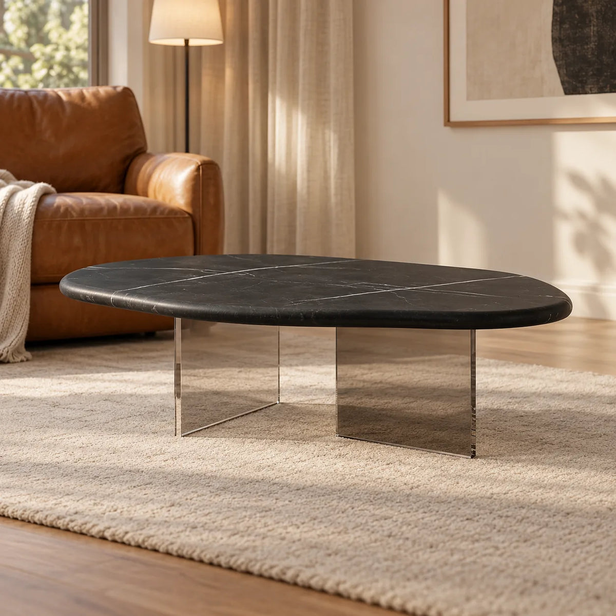 AquaFlow Black Marquina and acrylic coffee table in a quiet reading lounge, shown from a low front view.