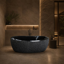 Calia BT-014A Absolute Black Granite hand-chiseled freestanding soaking bathtub in a refined low-light spa bathroom, second styled visualization