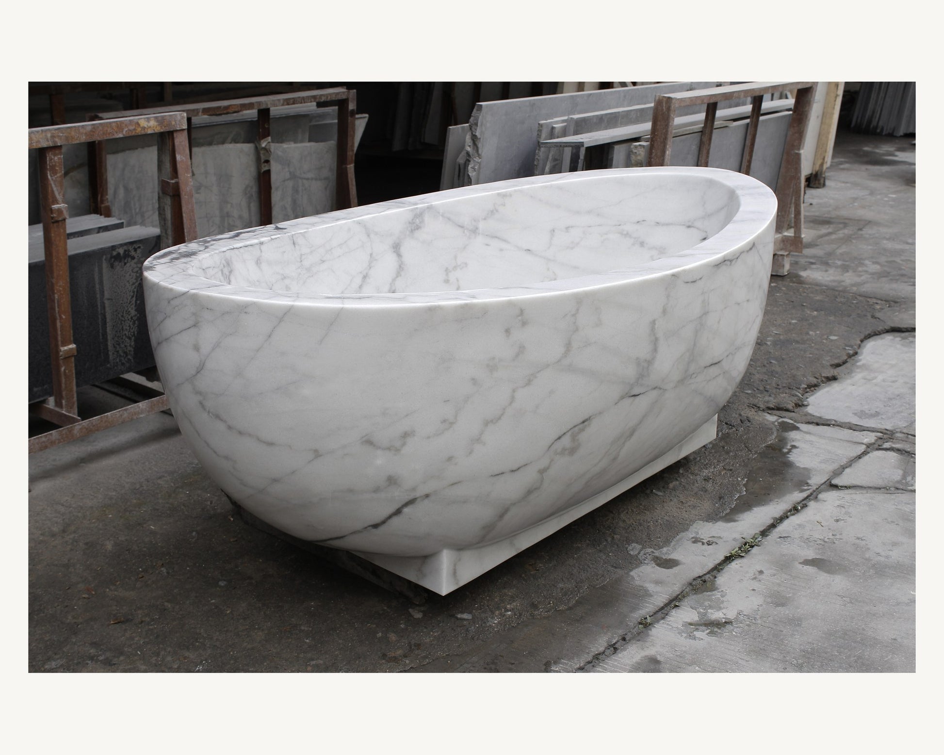 Celeste Ivory Cloud Marble soaking bathtub, real three-quarter workshop view