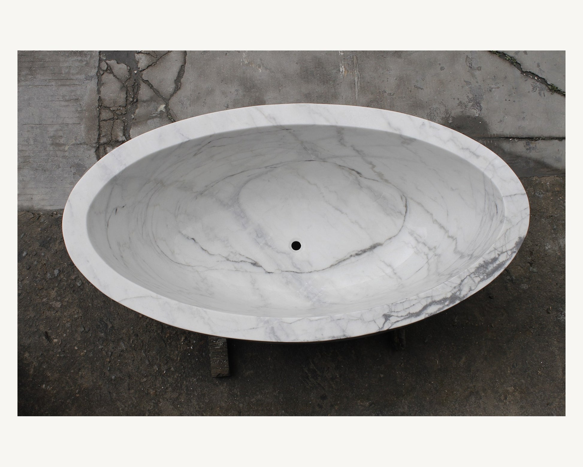 Celeste Ivory Cloud Marble soaking bathtub, real top view showing deep oval interior
