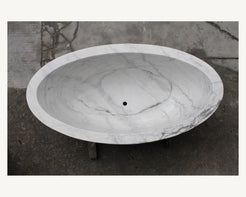 Celeste Ivory Cloud Marble soaking bathtub, real top view showing deep oval interior