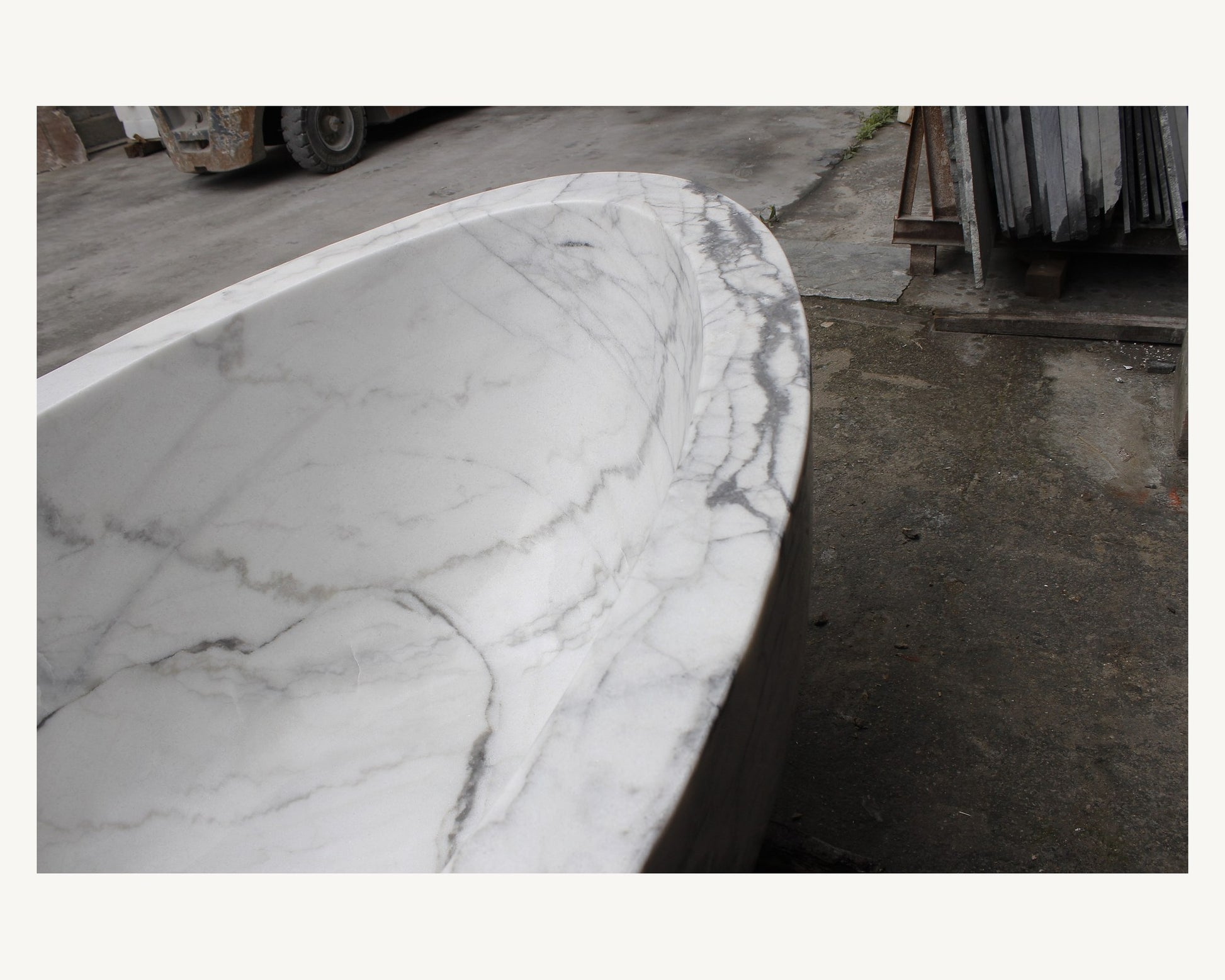Celeste Ivory Cloud Marble bathtub, real gray veining and thick rounded rim detail