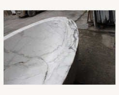 Celeste Ivory Cloud Marble bathtub, real gray veining and thick rounded rim detail