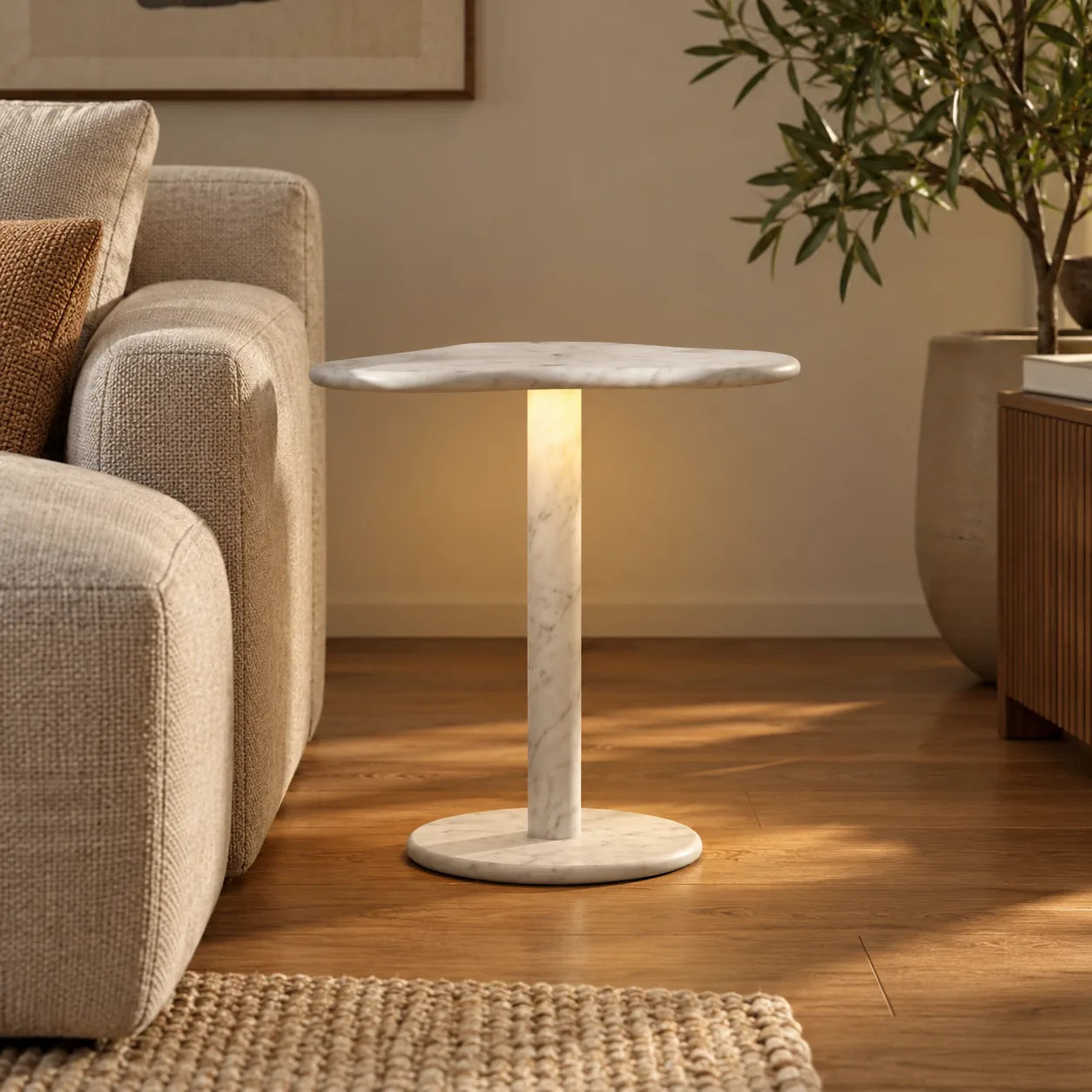 CloudDream Carrara marble smart-edition side table beside a sand linen sofa, shown from a low front view