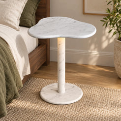 CloudDream Carrara marble smart-edition side table beside a walnut bed, shown from a mid-height front view