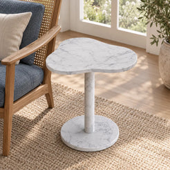 CloudDream Carrara marble side table viewed from an elevated angle in a garden-window lounge.
