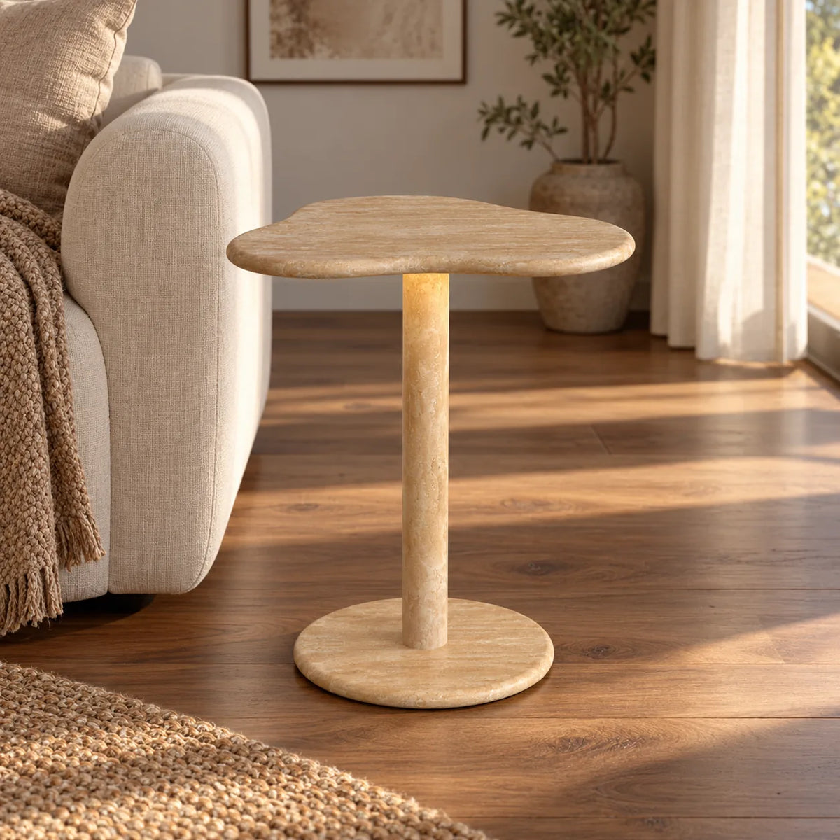 CloudDream Italian Classico travertine smart-edition side table beside an ivory sofa, shown from a low front view