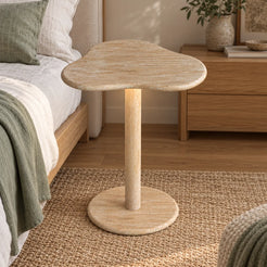 CloudDream Italian Classico travertine smart-edition side table beside an oak bed, shown from a mid-height front view