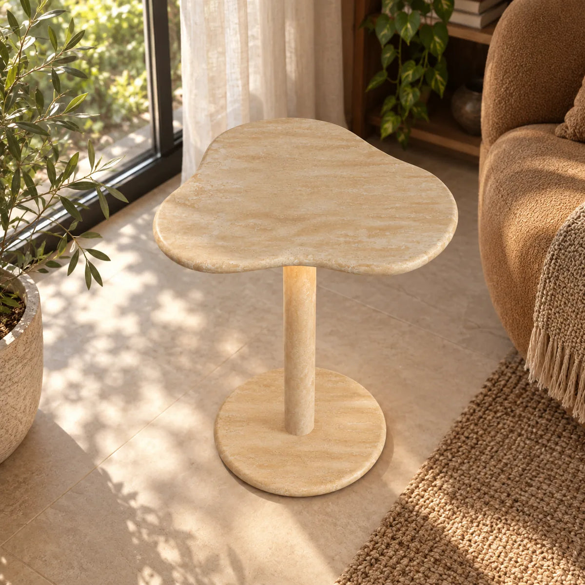 CloudDream Italian Classico travertine smart-edition side table beside a caramel reading chair, shown from a high front view