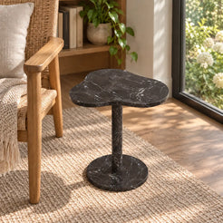 Elevated view of the CloudDream Dark Emperador marble side table in a window-side reading corner.
