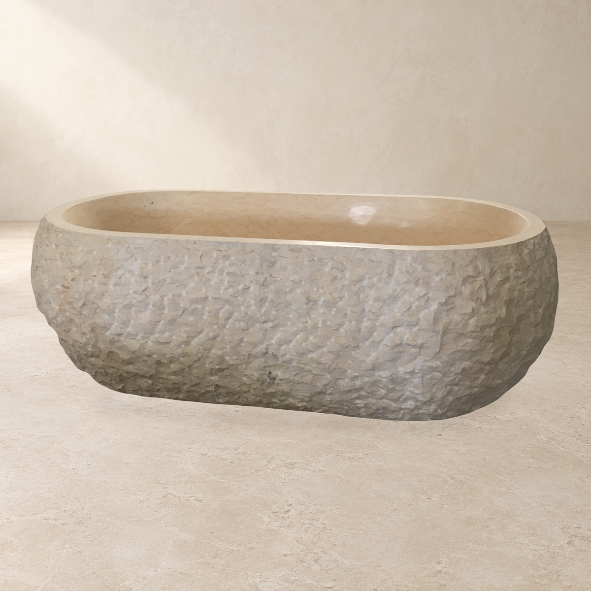 Dorienne BT-201A Golden Beige Marble bathtub, wide side-profile product photograph IMG_8663 with a replaced warm stone showroom background; original marble veining, rim and irregular natural rough-pick exterior retained.