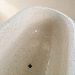 Dorienne BT-201A Golden Beige Marble bathtub, close interior, marble veining and circular drain detail from product photograph IMG_8670 with a replaced neutral background; original visible basin and rim retained.