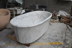 Elara BT-024A Ivory Cloud Marble bathtub, original product reference view; source photograph reframed without changing the stone, rim or silhouette