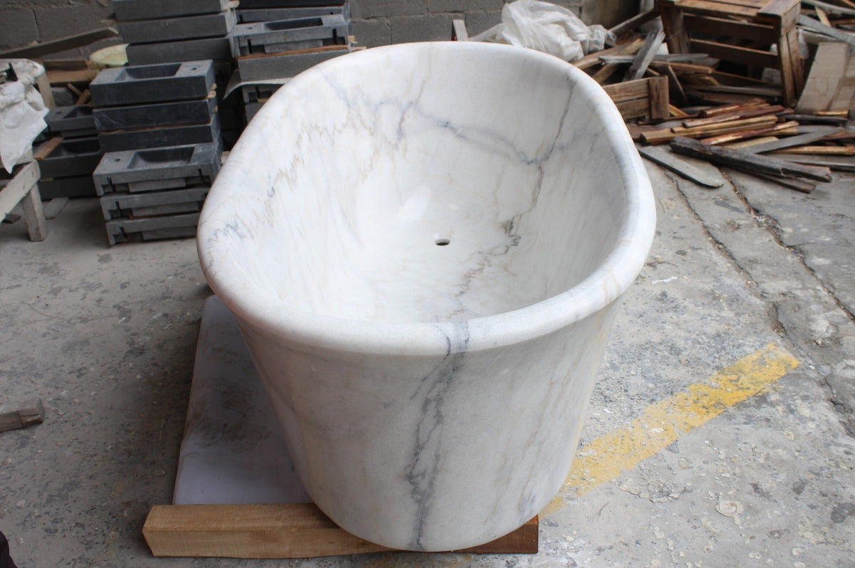 Elara BT-024A Ivory Cloud Marble bathtub, original product reference view; source photograph reframed without changing the stone, rim or silhouette