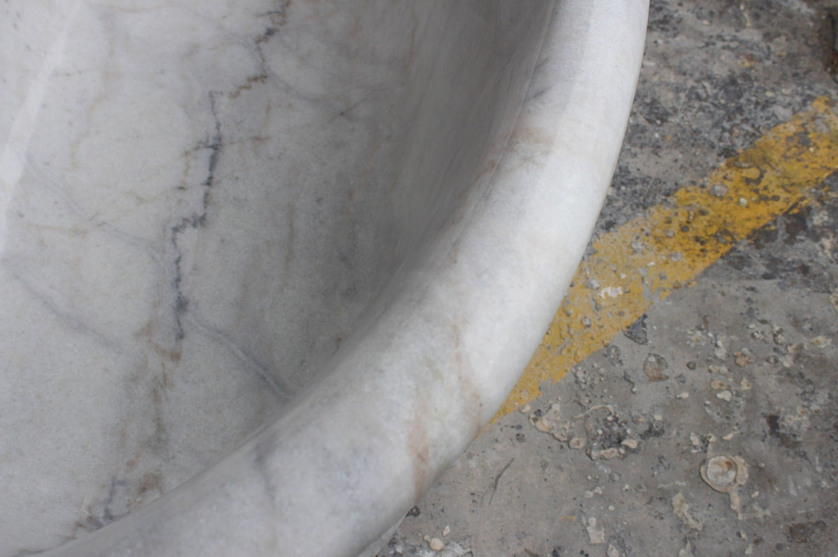 Elara BT-024A Ivory Cloud Marble bathtub, original product reference view; source photograph reframed without changing the stone, rim or silhouette