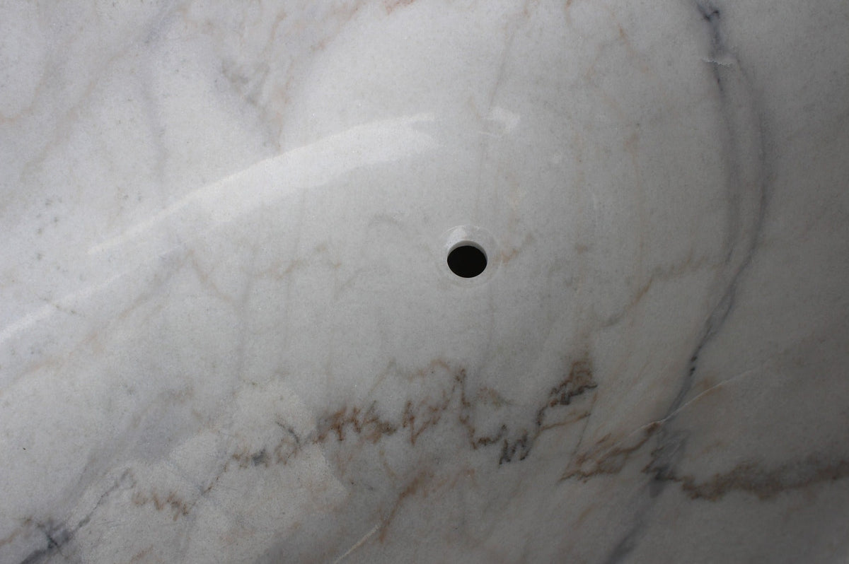 Elara BT-024A Ivory Cloud Marble bathtub, original product reference view; source photograph reframed without changing the stone, rim or silhouette