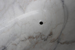 Elara BT-024A Ivory Cloud Marble bathtub, original product reference view; source photograph reframed without changing the stone, rim or silhouette