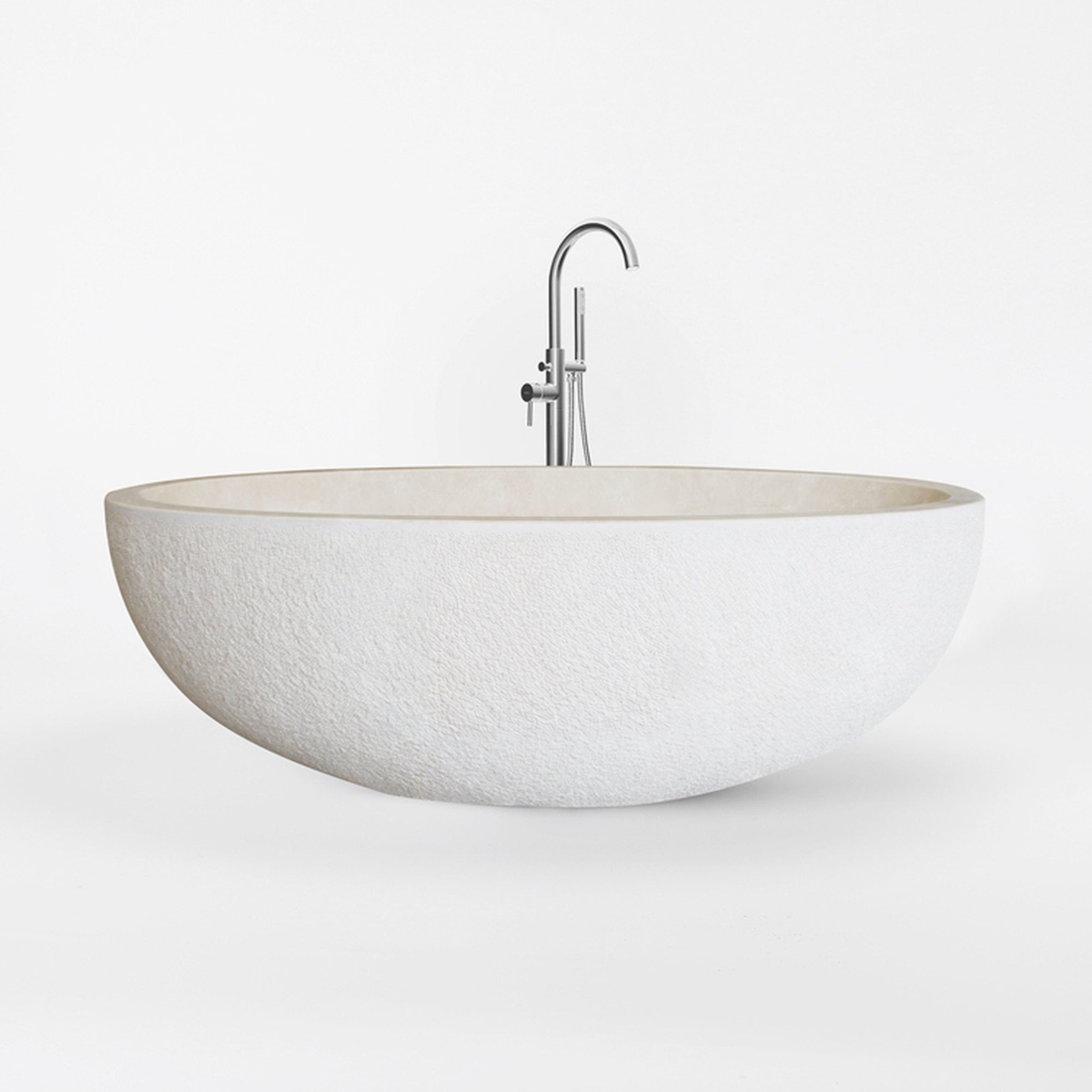 Evania Crema Marfil Extra Marble bathtub with hand-chiseled exterior, studio front-view visualization