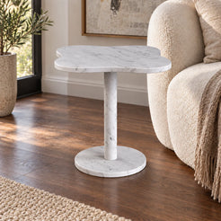 LakeMist Italian Carrara marble side table beside an ivory sofa, shown from a low oblique view