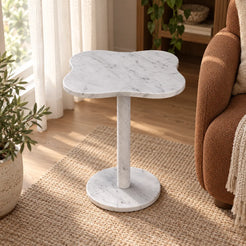 LakeMist Carrara marble side table in a window reading space, shown from an elevated oblique view