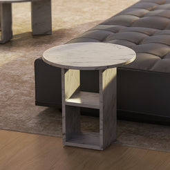 Carrara marble side table with décor in a bedroom setting