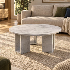 MarbleNook Carrara marble coffee table in a linen-sofa living room, shown from a moderately elevated view