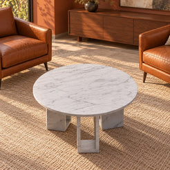 MarbleNook Carrara marble coffee table in a leather-chair conversation lounge, shown from a high front-quarter view