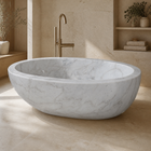 Marella Oval Freestanding Soaking Bathtub – Ivory Cloud Marble in a warm ivory-limestone luxury bathroom; exact product geometry and material preserved