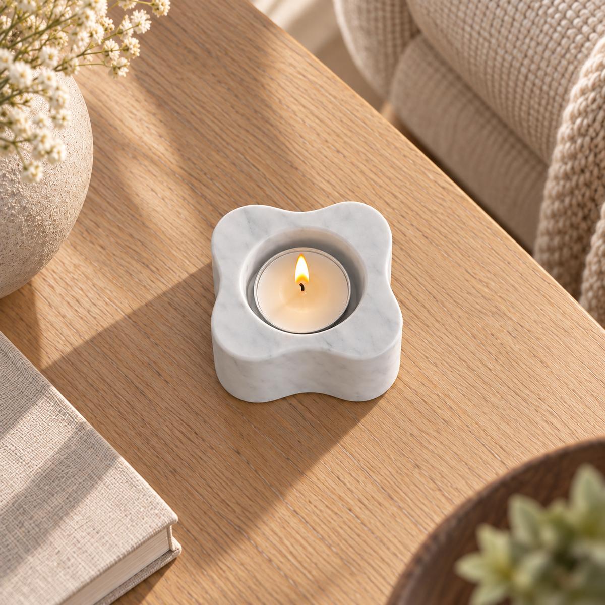 LakeMist Short white Carrara candle holder, near-overhead view on a warm wood table