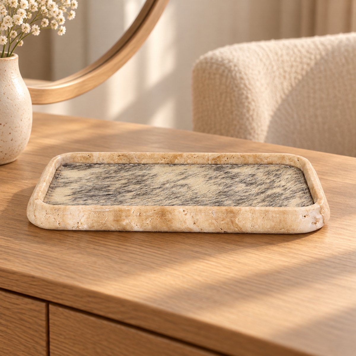ZenFur beige travertine tray with horse-fur lining, low frontal view on a warm wood vanity